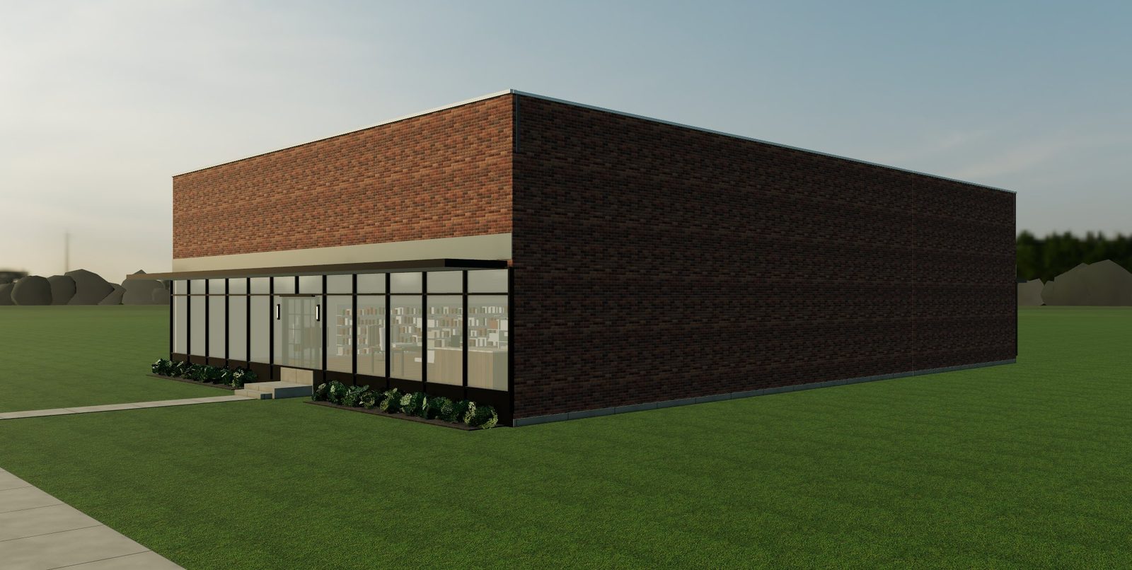 A brick retail building with a black aluminum storefront and a steel canopy